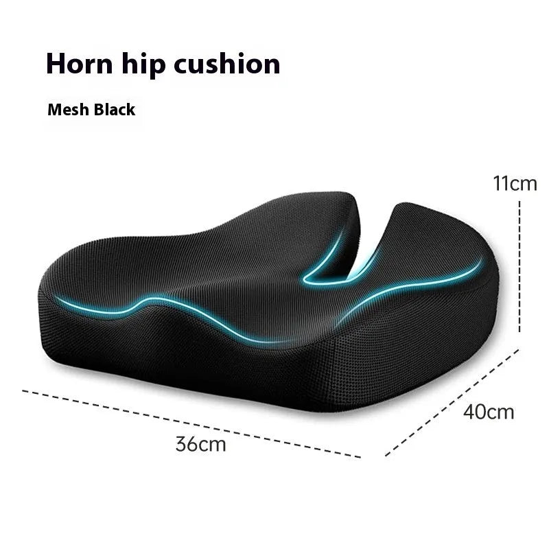 Dark grey memory foam office chair cushion with contoured shape for lower back support on a desk chair.