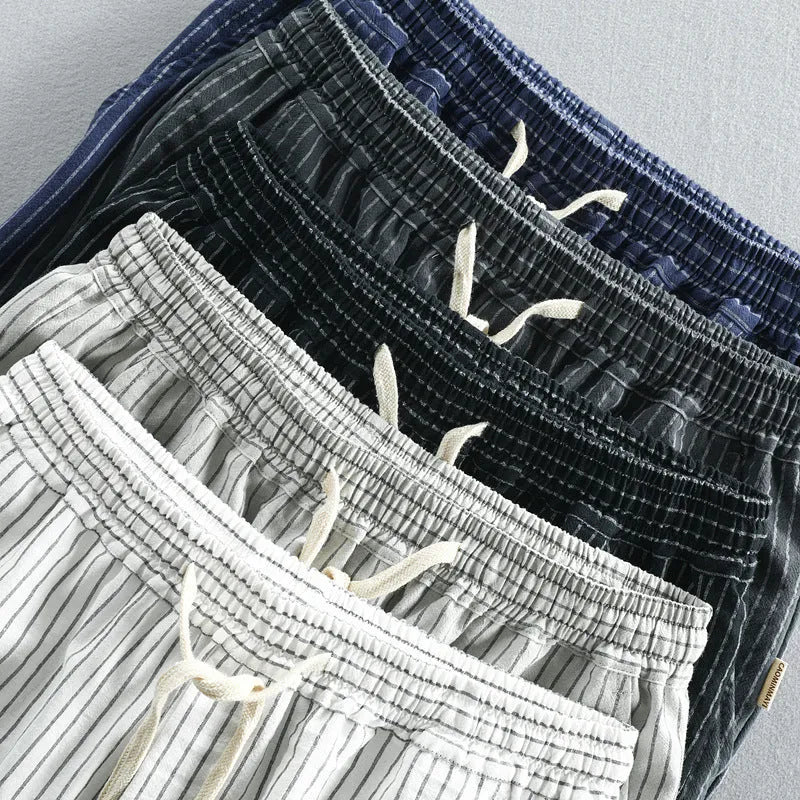 Men's striped cotton casual shorts showing straight-leg design and mid-waist fit