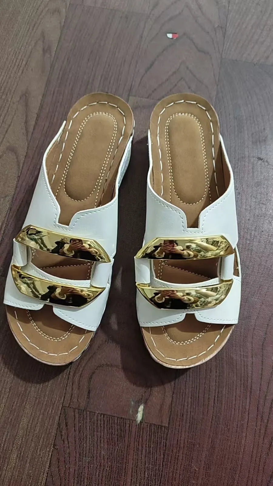 Roman style platform flip-flops in black, white, khaki, or sea blue with a rubber sole.