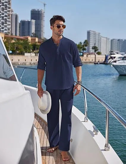 Men's casual cotton suit set in a solid colour, featuring a long-sleeved top and matching trousers.