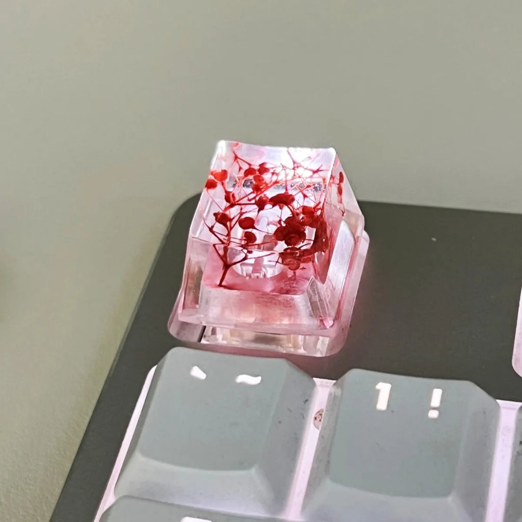 Single resin mechanical keyboard keycap with high transparency and embedded starry sky design, shown in violet colour.