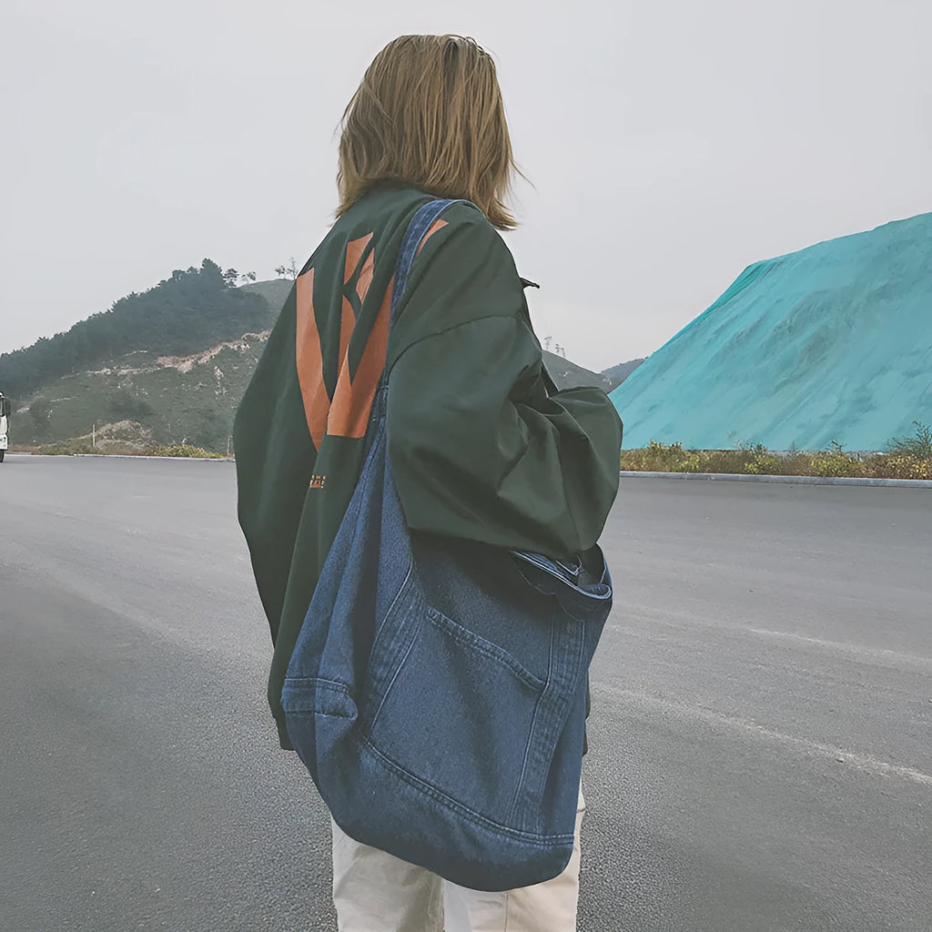 Large canvas denim tote bag in dark blue with polyester lining and horizontal square shape