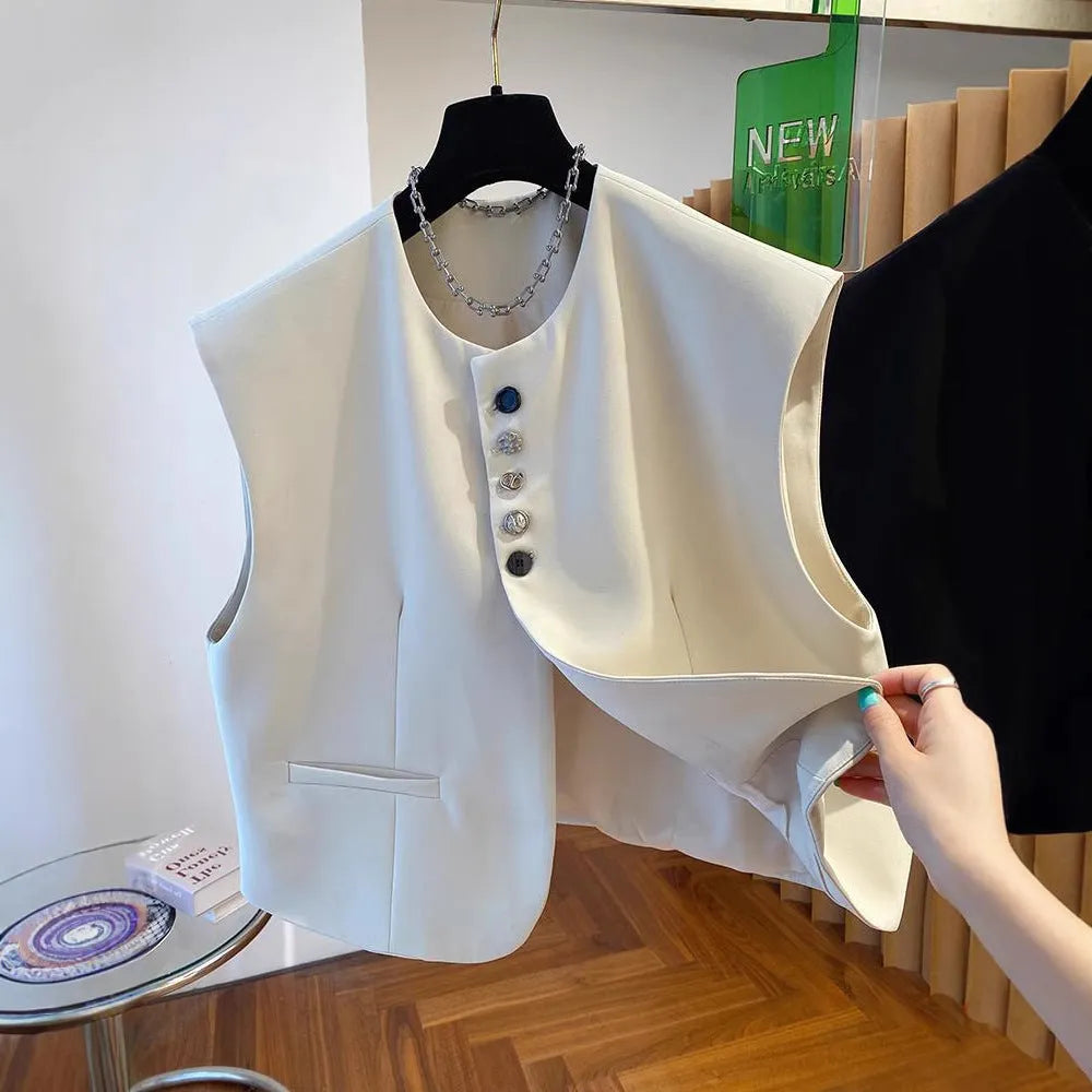 Women's loose-fitting beige polyester waistcoat vest with pockets on a hanger.