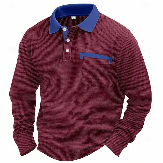 Man modelling a loose-fit long-sleeved waffle-knit polo shirt in a solid colour with an asymmetrical style detail.