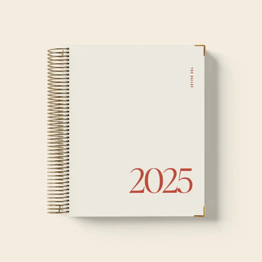 Cherry Red coil notebook with spiral binding open on a desk