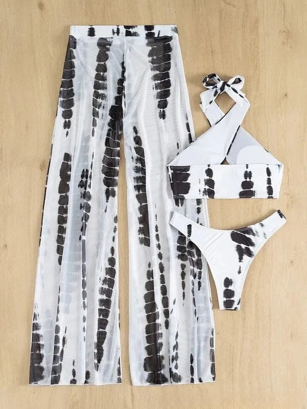 Women's black printed three-piece swimsuit set with bikini top, bottoms, and mesh trousers.