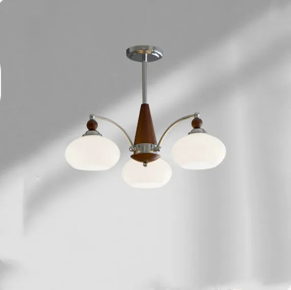 Persimmon glass and chrome chandelier with multiple lampshades in a Middle Ancient style