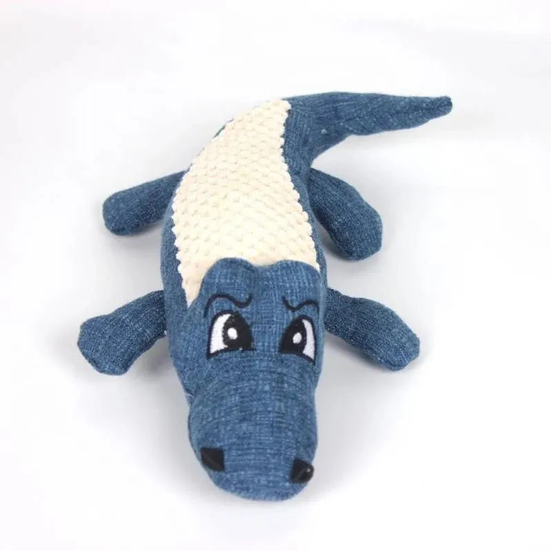 Blue, green, and red corn cob shaped plush dog toy with a textured surface on a white background.