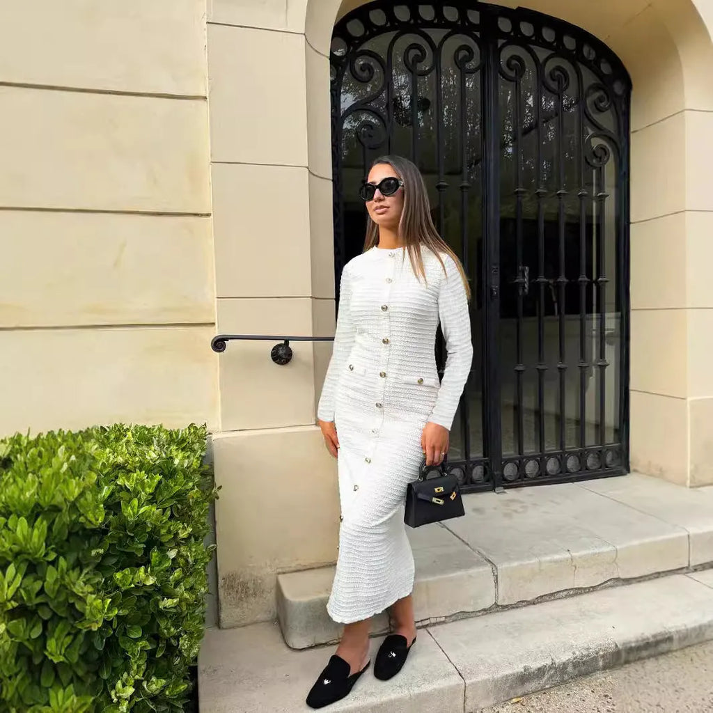 Women's slim fit knitted dress with long sleeves and button detailing in retro French style