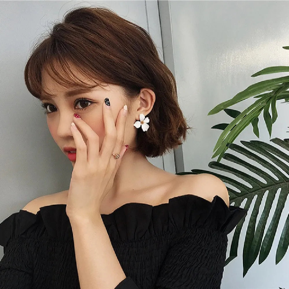 Women's flower stud earrings in pink and white colour options with electroplated alloy construction