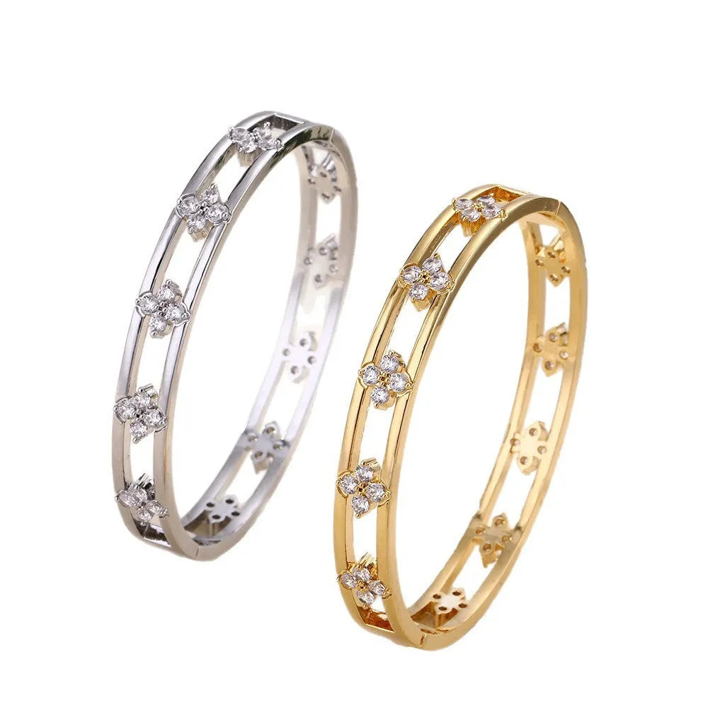 Gold or silver women's hollow bracelet with four-leaf clover design and zircon stones.