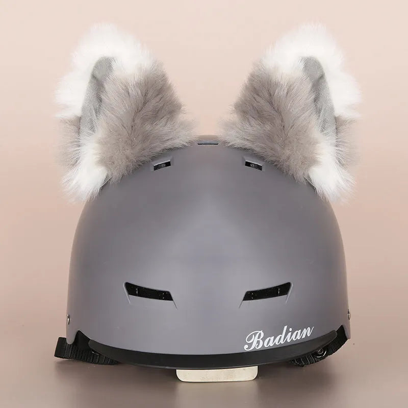 A plush fabric cartoon character helmet hat cover with attached ears on a white background.
