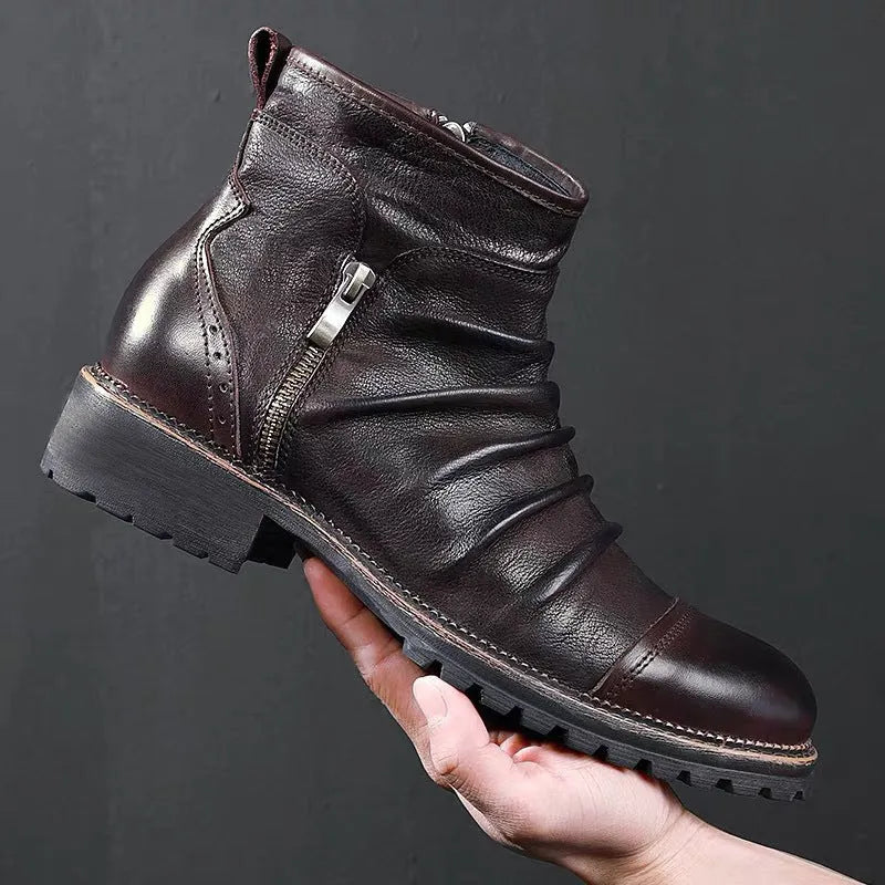 Black and brown mid-calf cowboy boots with a side zipper, round toe, and horseshoe heel