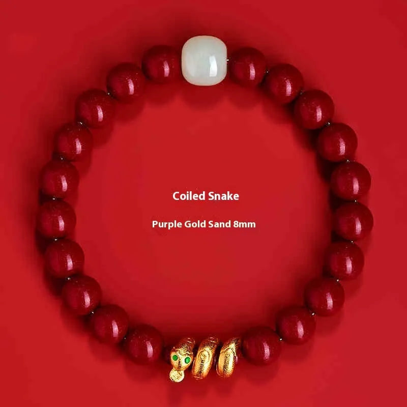 Handmade cinnabar snake zodiac bracelet with roll beads, shown in Chinese style.