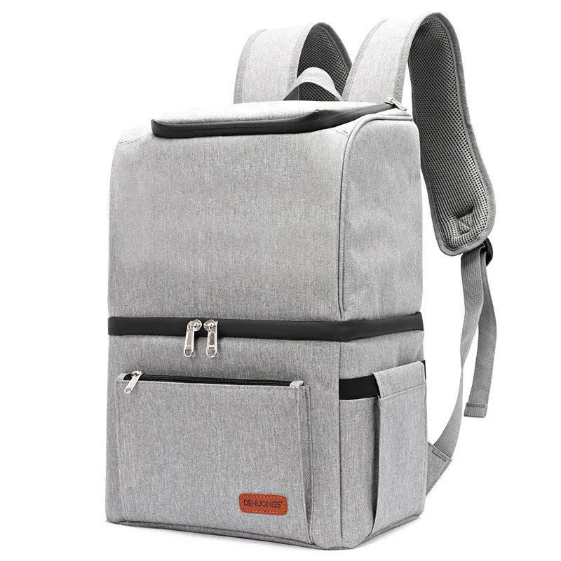 Blue double-layer insulated waterproof backpack cooler with 22 litre capacity shown outdoors.