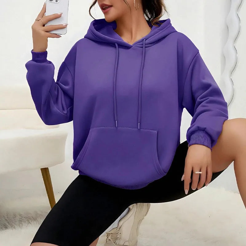 Women's loose fit grey sweatshirt with drawstring hood and kangaroo pocket