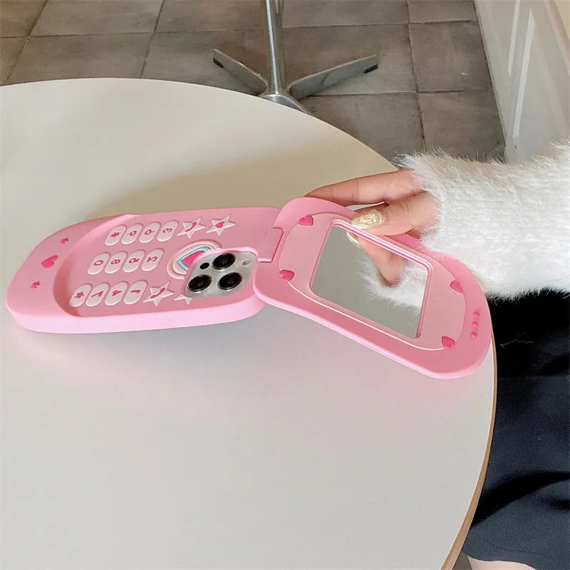 Pink silicone flip phone shaped iPhone case with built-in mirror for models 11 to 15