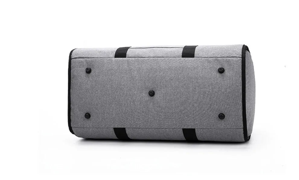 Medium-sized cylinder travel bag in Oxford cloth, shown in one of four colours: black, blue, light grey or red.