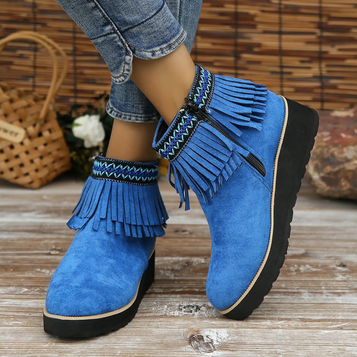 Womens dark brown suede wedge ankle boots with side zip and tassel detail on a thick rubber sole.