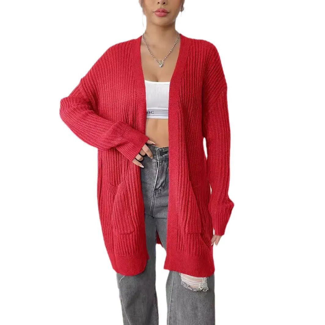 Women's loose acrylic cardigan with two pockets in dark green colour, mid-length design