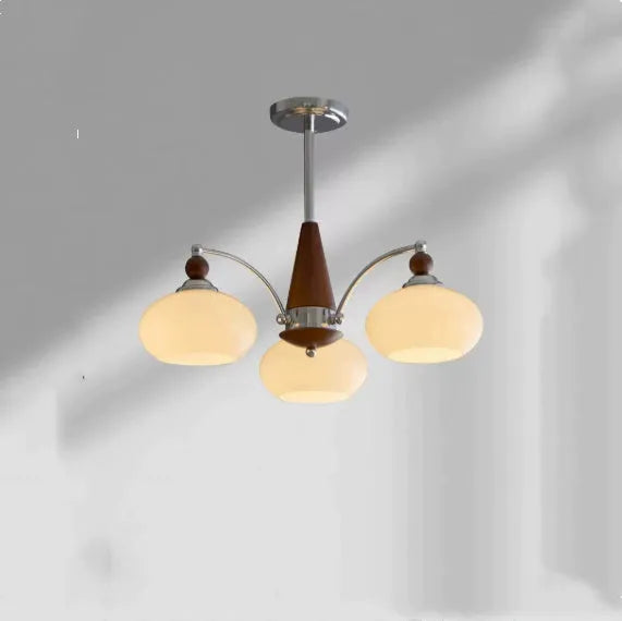Persimmon glass and chrome chandelier with multiple lampshades in a Middle Ancient style
