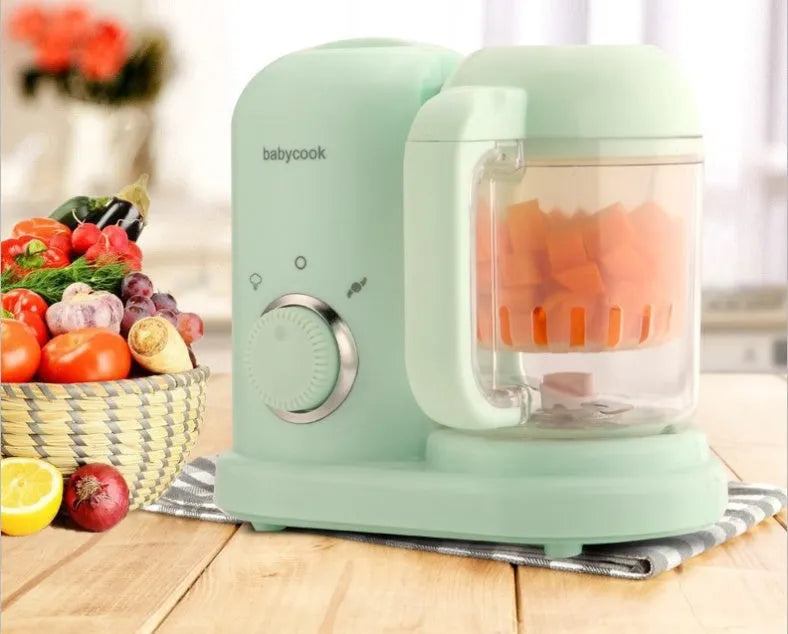 Green baby food processor with steamer and blender functions and a 10-litre capacity.