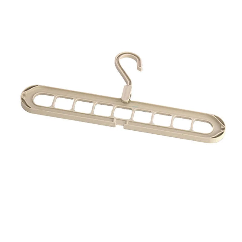 Green plastic nine-hole folding hanger for trousers displayed open and closed.