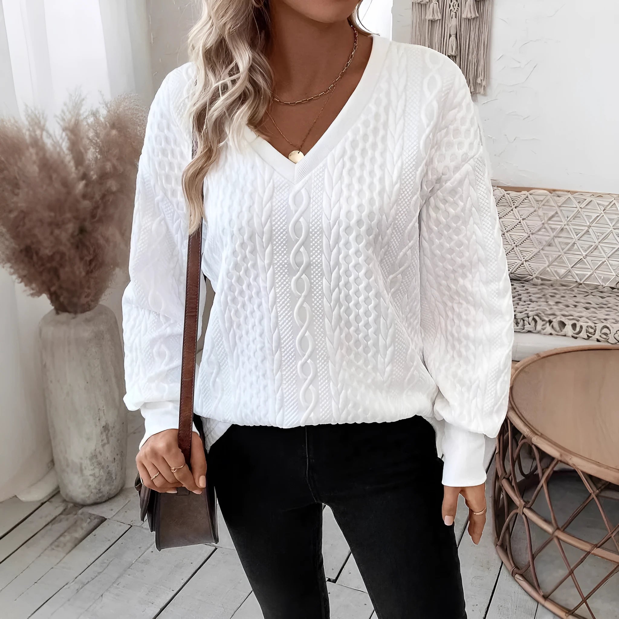 Milky white loose fit long sleeve t-shirt with a 3D pattern on a hanger