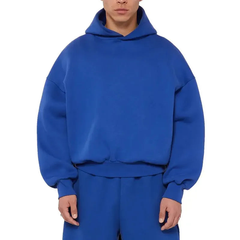 Men's solid color fleece-lined pullover hoodie with threaded long sleeves in gray, black, blue, or red.