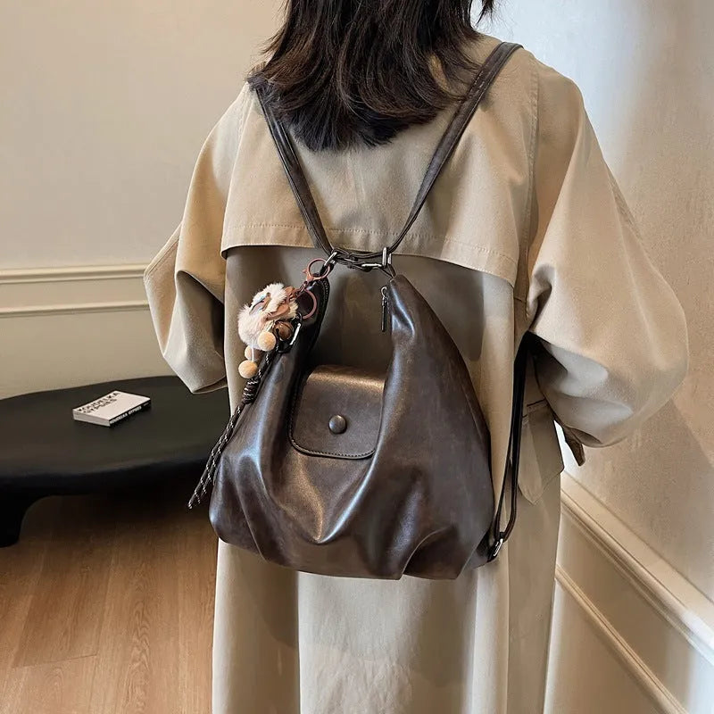 Women's black PU leather horizontal square shoulder bag with single strap and internal phone pocket