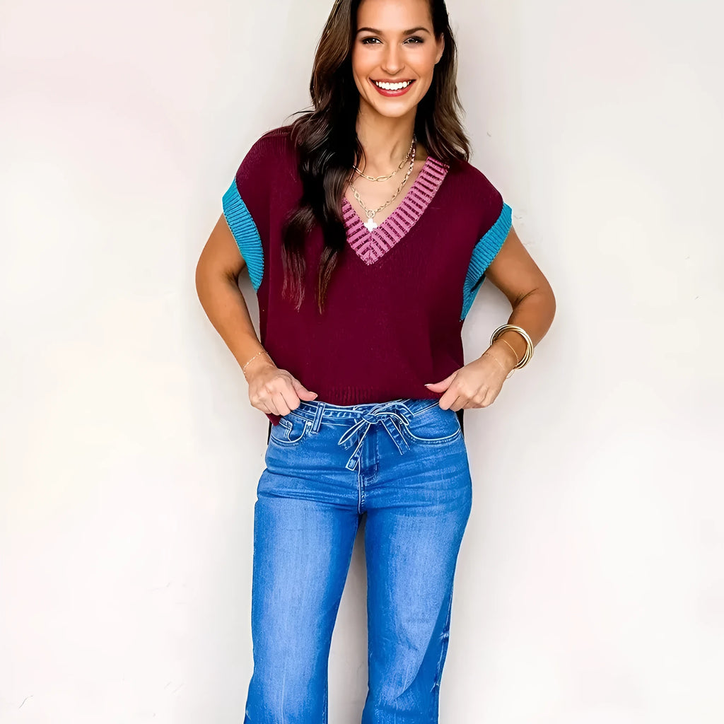 Burgundy women's loose V-neck sweater with white contrast trim and cuffed short sleeves
