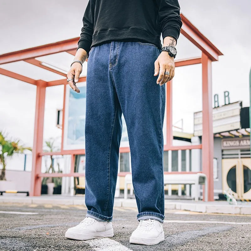 Men's loose straight cotton jeans in dark blue, light blue, and gray with mid-waist zipper fly