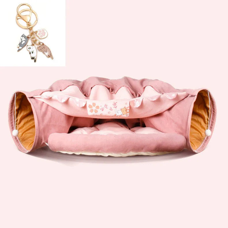 A collapsible cloth cat tunnel in Bar colour, showing its arched shape and dimensions for feline play.