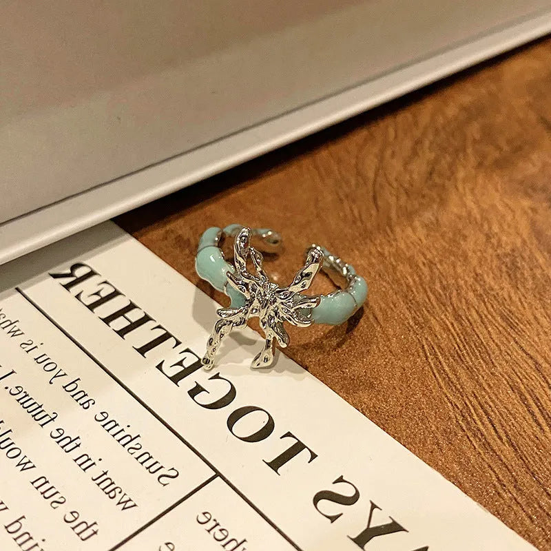 Women's copper butterfly ring with dripping oil finish and adjustable open loop design