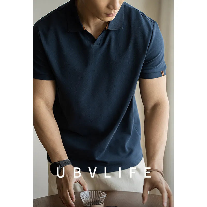 American-style cotton-polyester breathable short-sleeved polo shirt in blue colour showing regular fit and casual styling