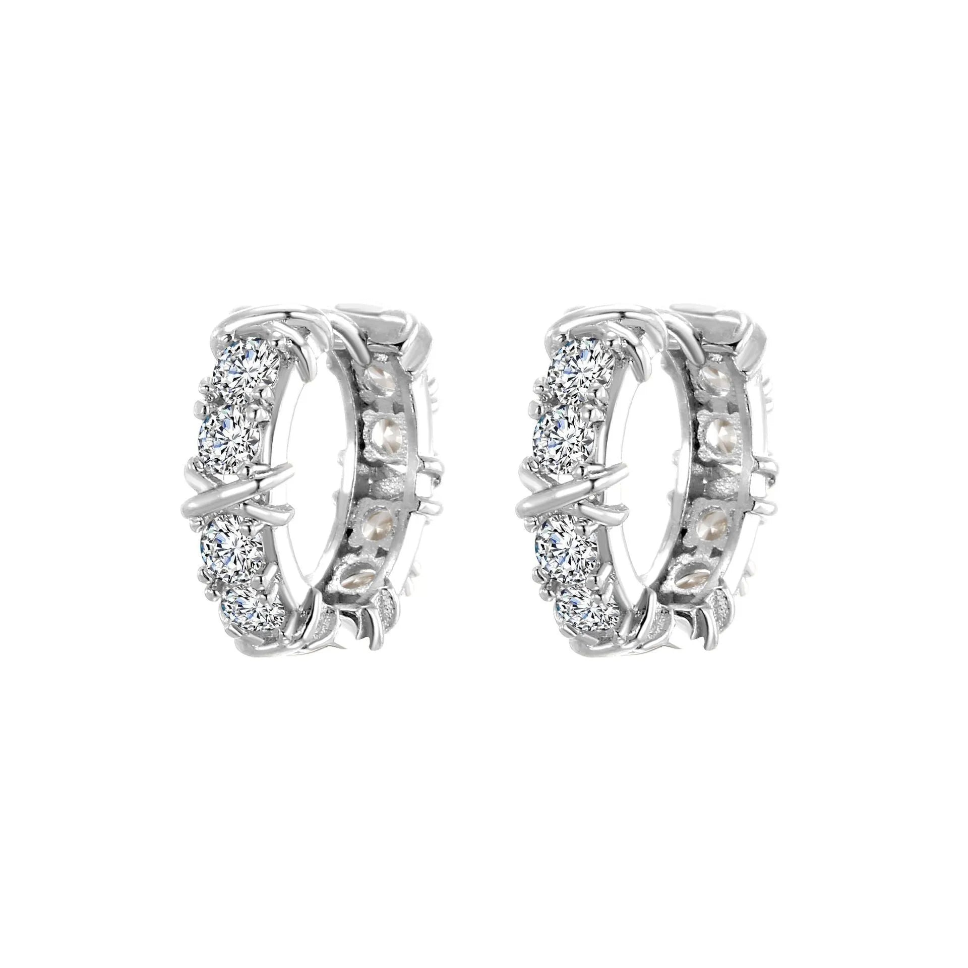 A pair of geometric hexagonal clover cross earrings with an elliptical shape in a silver colour finish.
