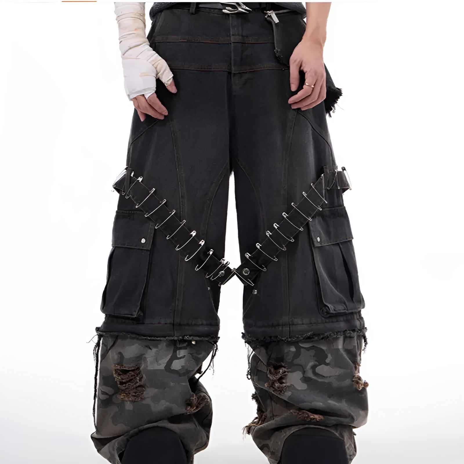 Men's grey and camouflage colour-block jeans with a structured pin and ribbon detail.