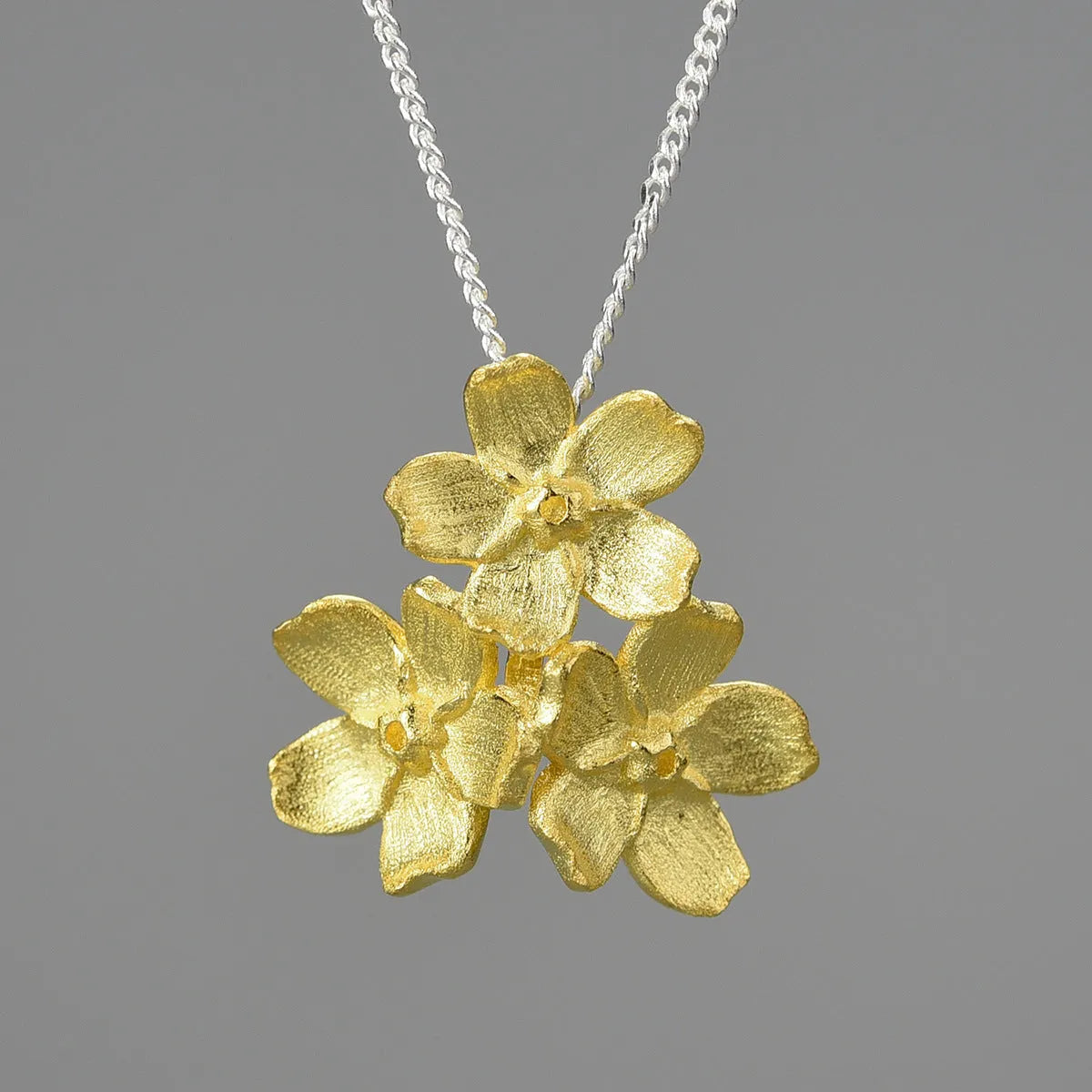 Myosotis Sylvatica sterling silver floral pendant with pastoral design in electroplated finish