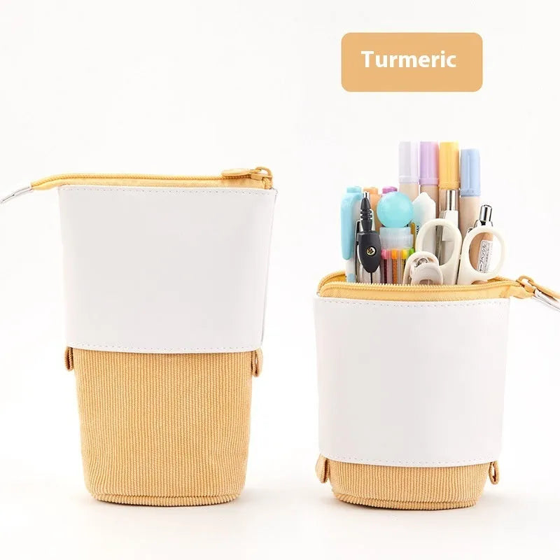 Corduroy drop-down telescopic stationery case in six colour options on a desk