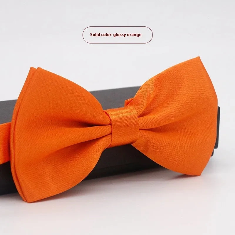 Men's flat head solid colour bow tie in polyester, showing 12cm by 6cm size on a background.