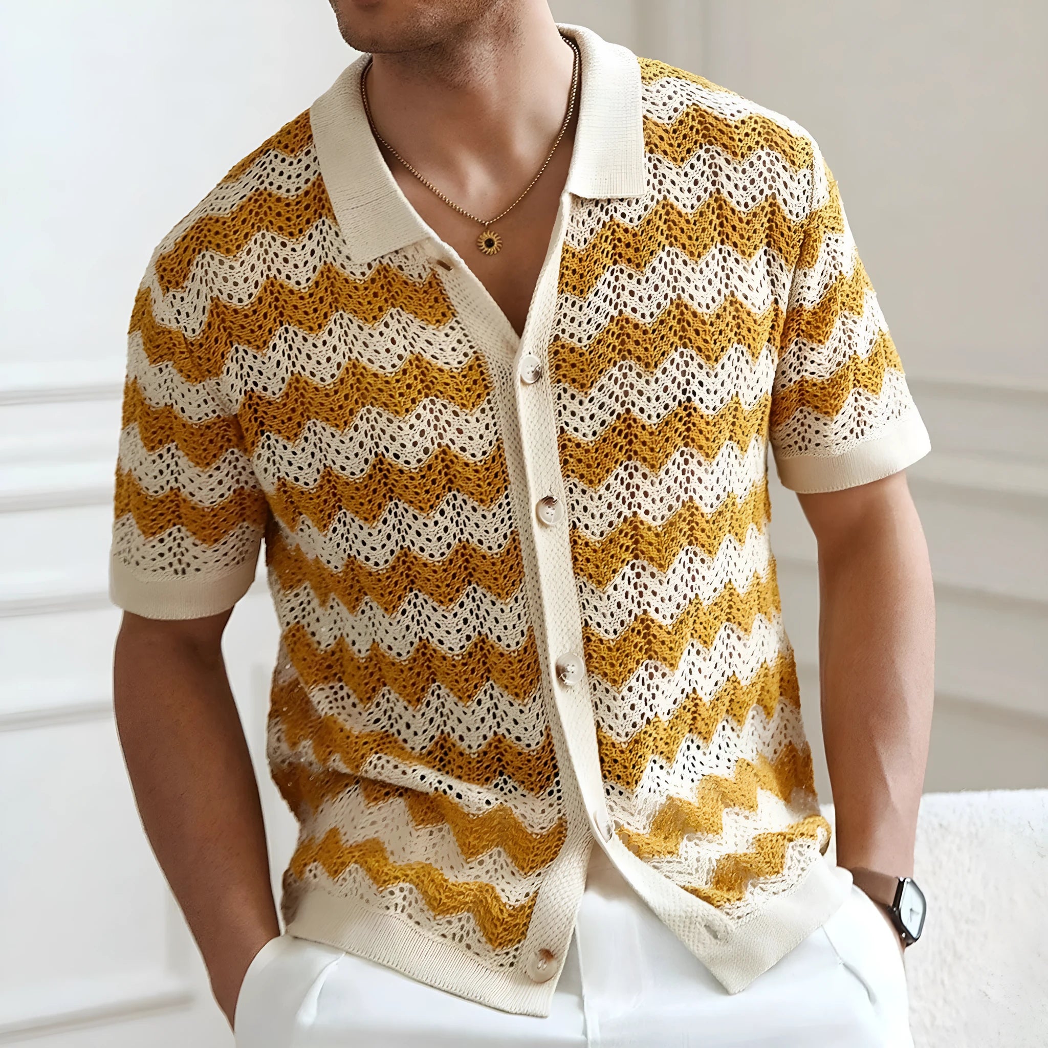 Short-sleeved yellow hollow jacquard corrugated sweater with flocked detail on a mannequin.