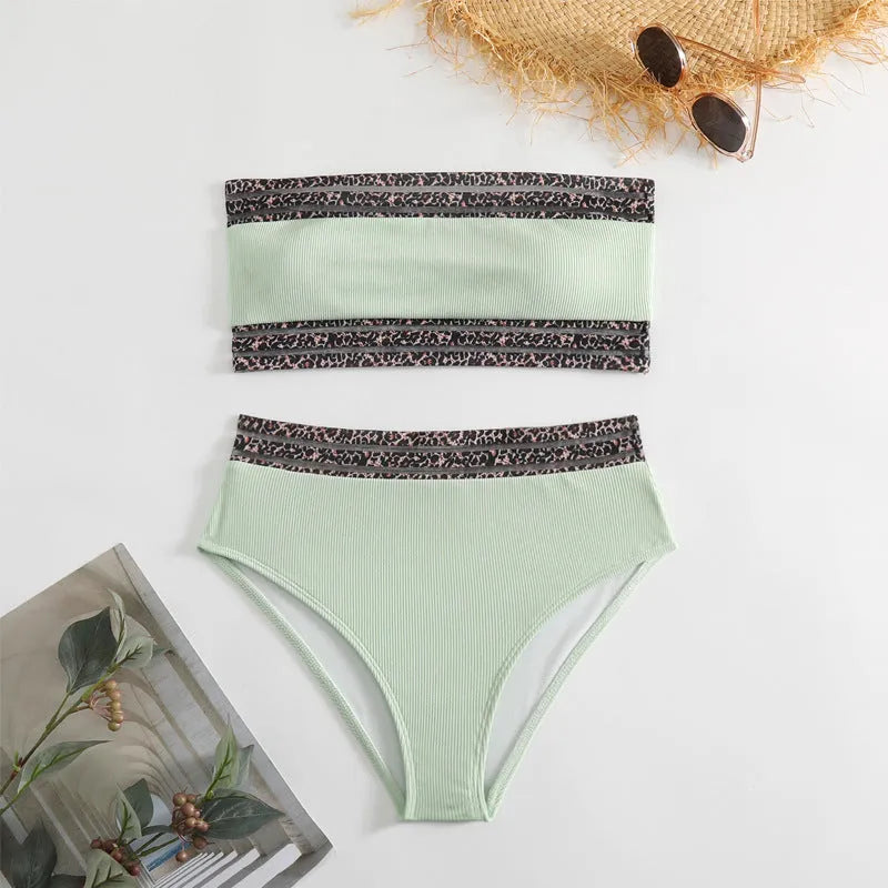 Black strapless bikini set with leopard pattern splicing detailing, showing bra and shorts pieces
