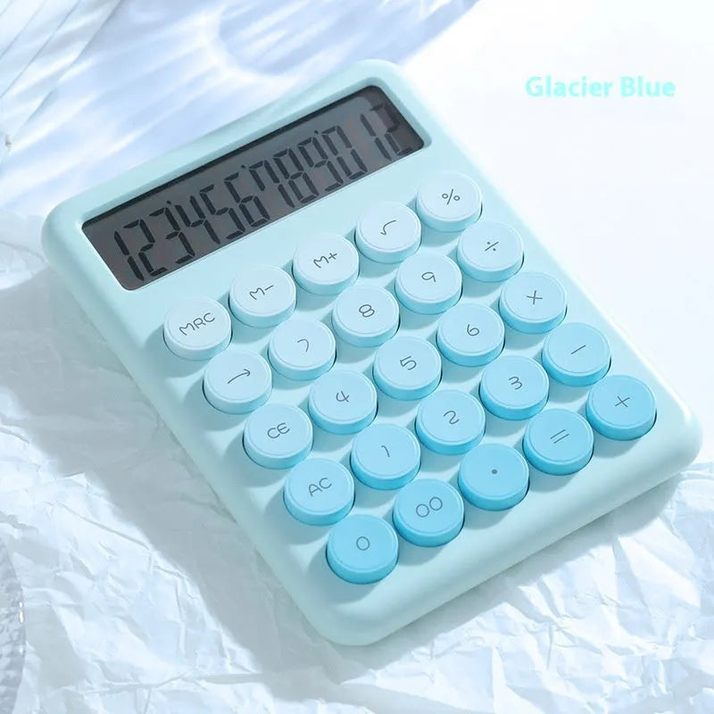 Dopamine gradient colour desk calculator in violet, pink, blue, and mint green on a desk.