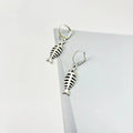 Fishbone pendant necklace and earrings set with adjustable chain on white background