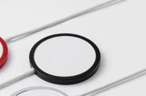 Magsafe magnetic wireless charger for Apple iPhone in silver, black, blue, or red metal finish
