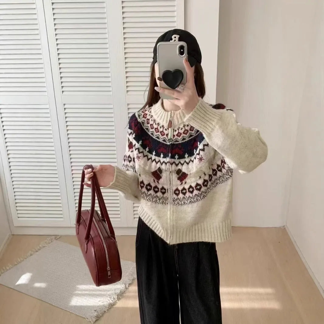 Women's ethnic jacquard pullover sweater with 3D pattern in beige apricot, showing loose fit and long sleeves.