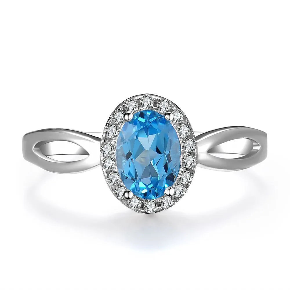 925 sterling silver jewellery set with blue topaz gems including earrings, ring, necklace and pendant