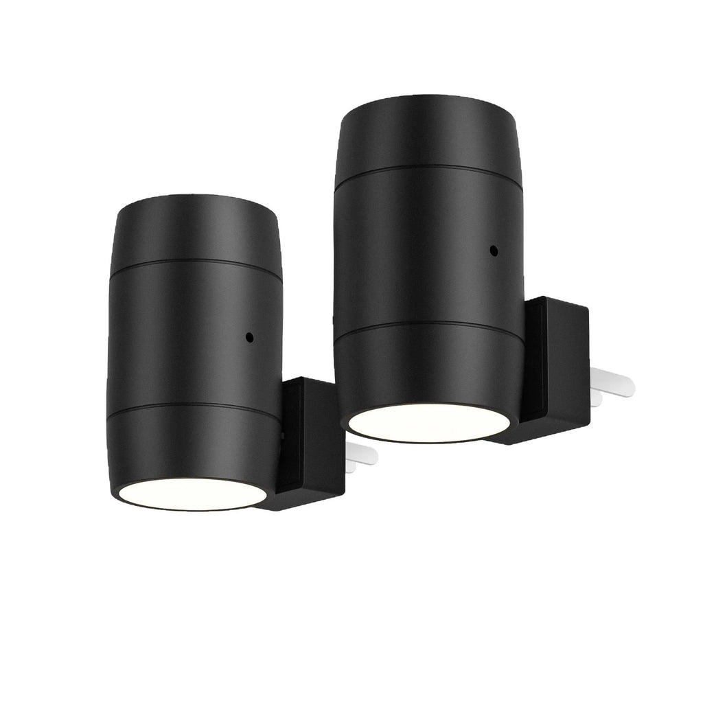Small white induction night lamp plugged into a wall socket with a rotatable head.
