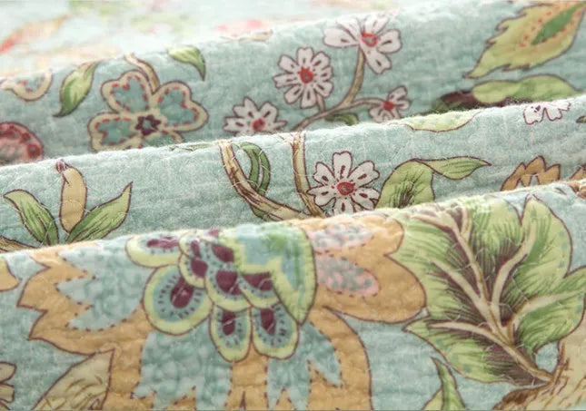 Blue American floral and bird quilted cotton bedspread set with three pieces for a double bed