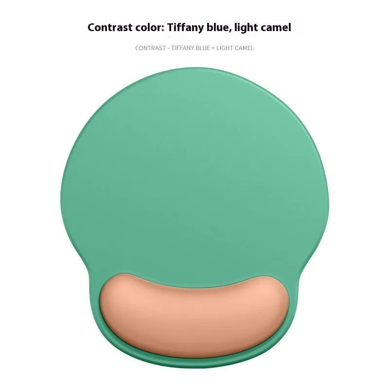 Silicone mouse mat with attached gel wrist support in a gradient blue colour on a desk.